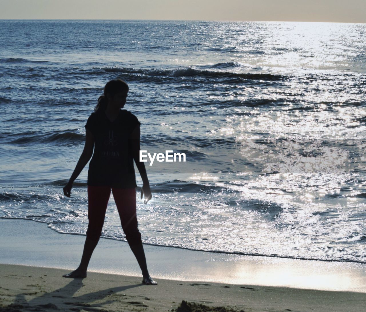 Woman standing at shore