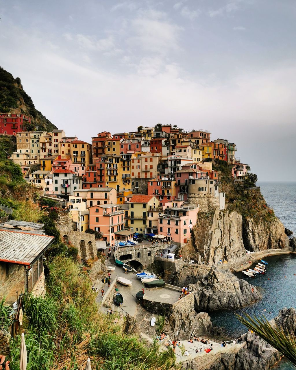 High angle view of townscape by sea against sky