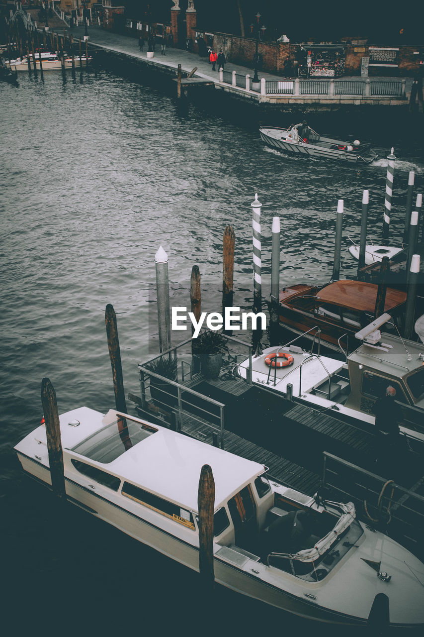 High angle view of boats moored at harbor