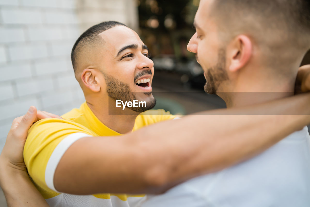 Gay couple embracing outdoors