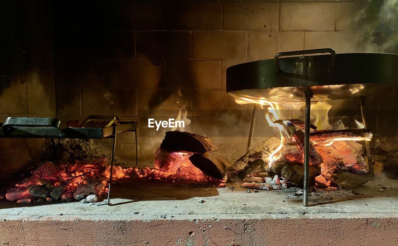 Burning candles on barbecue grill