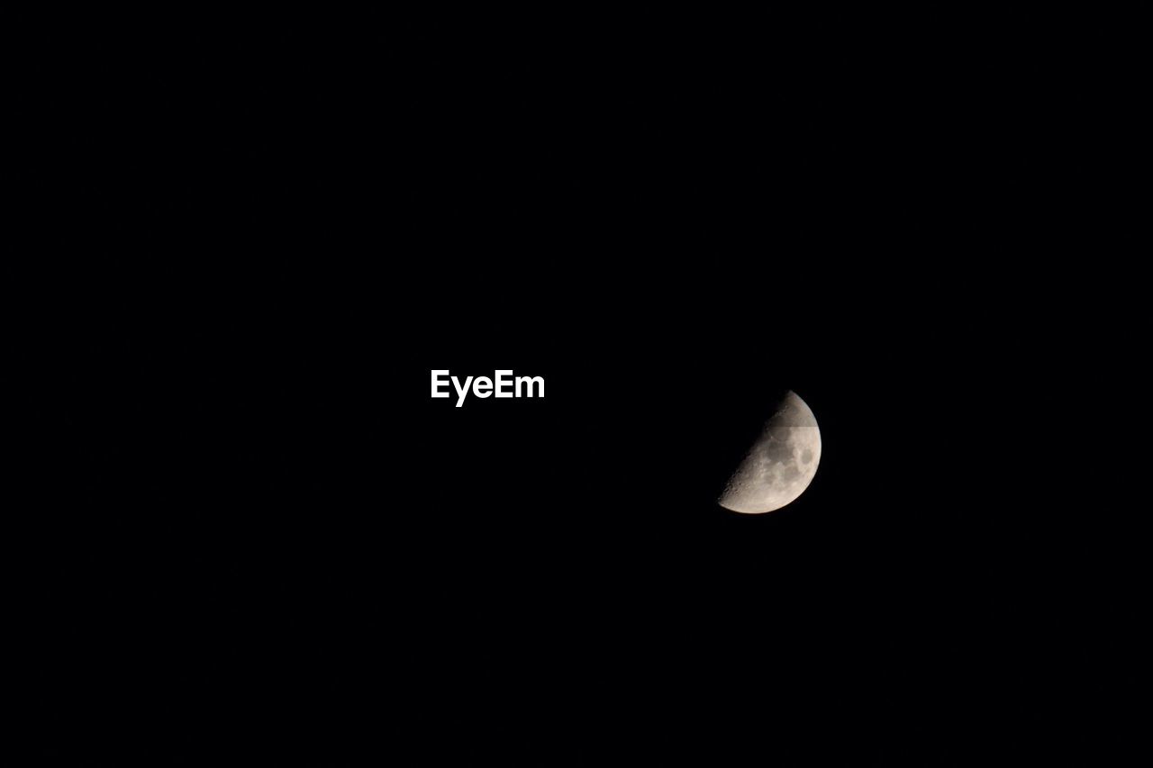 LOW ANGLE VIEW OF MOON IN THE DARK