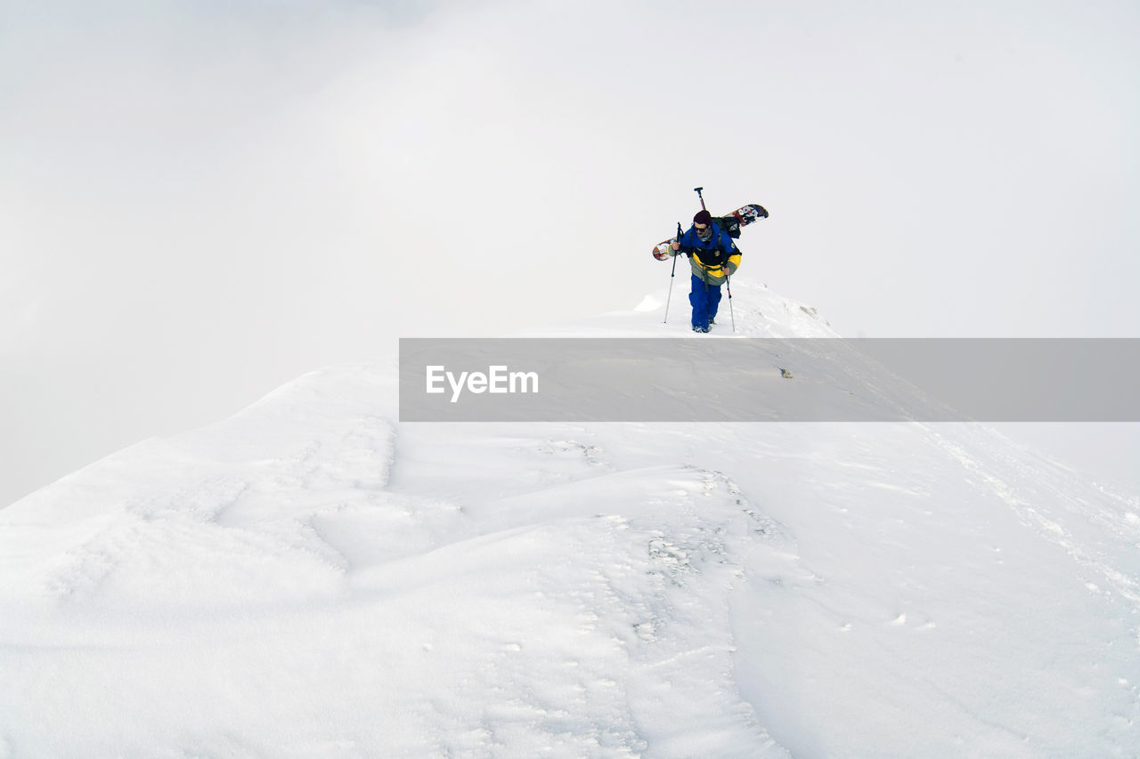 Snowboard and freeride on dolomites and snowpark, climbing the mountain