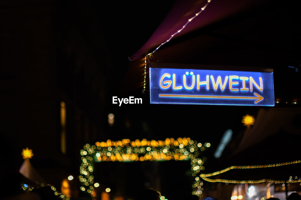 Illuminated information sign at night