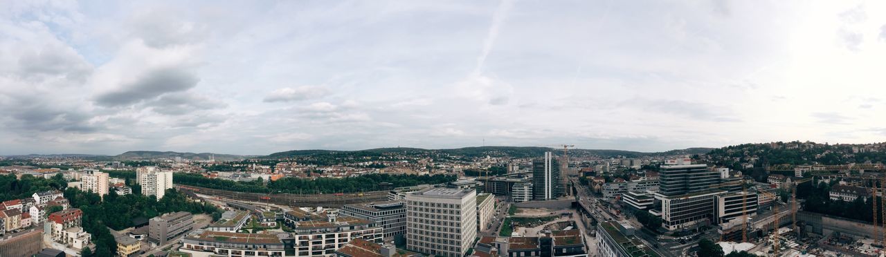 High angle view of cityscape against cloudy sky