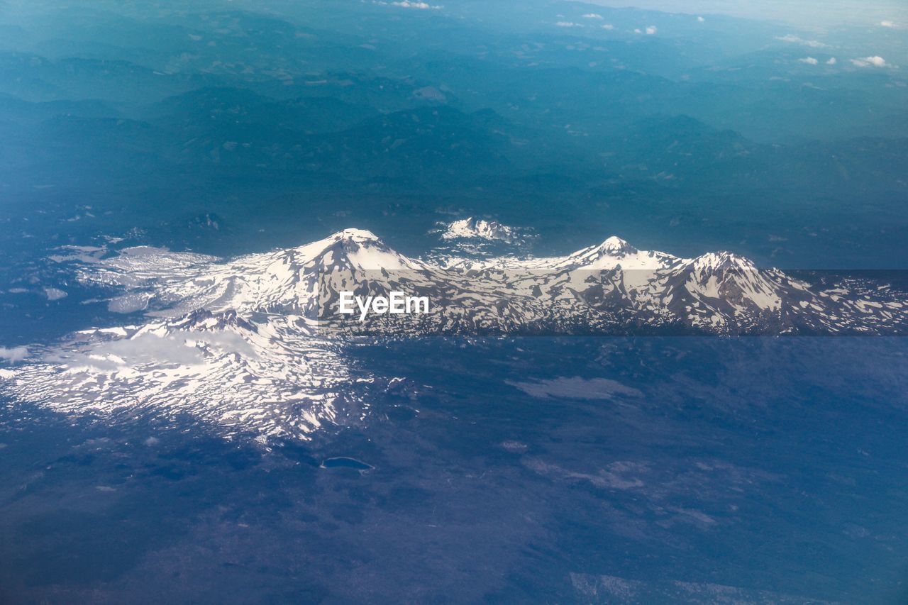 HIGH ANGLE VIEW OF SNOWCAPPED MOUNTAIN
