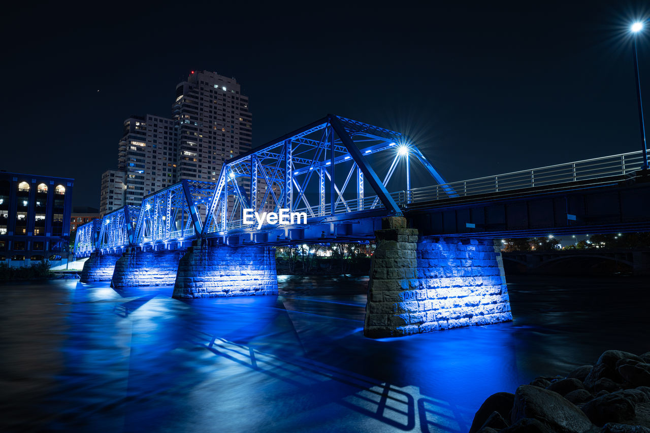  blue bridge of downtown grand rapids glows vibrant after dark