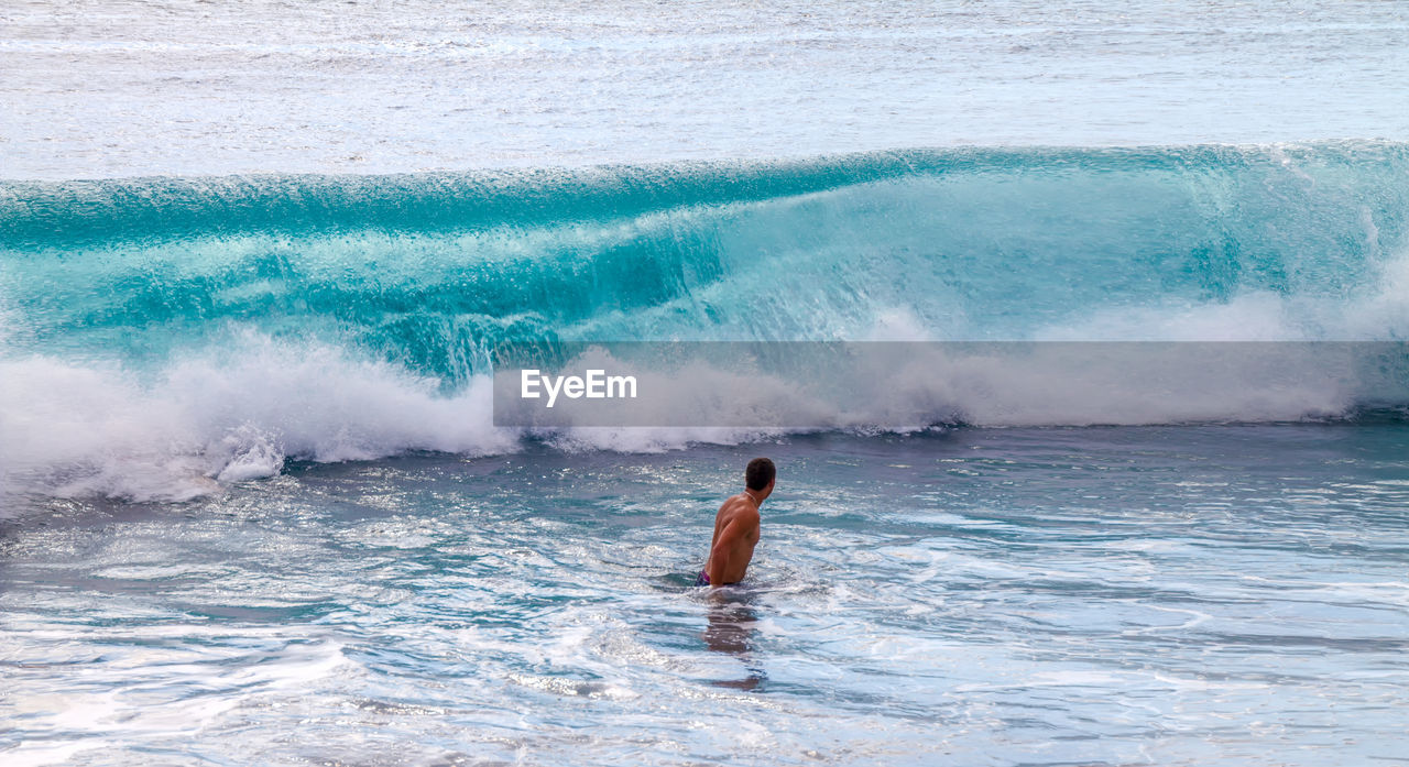 View of a man swimming in the sea