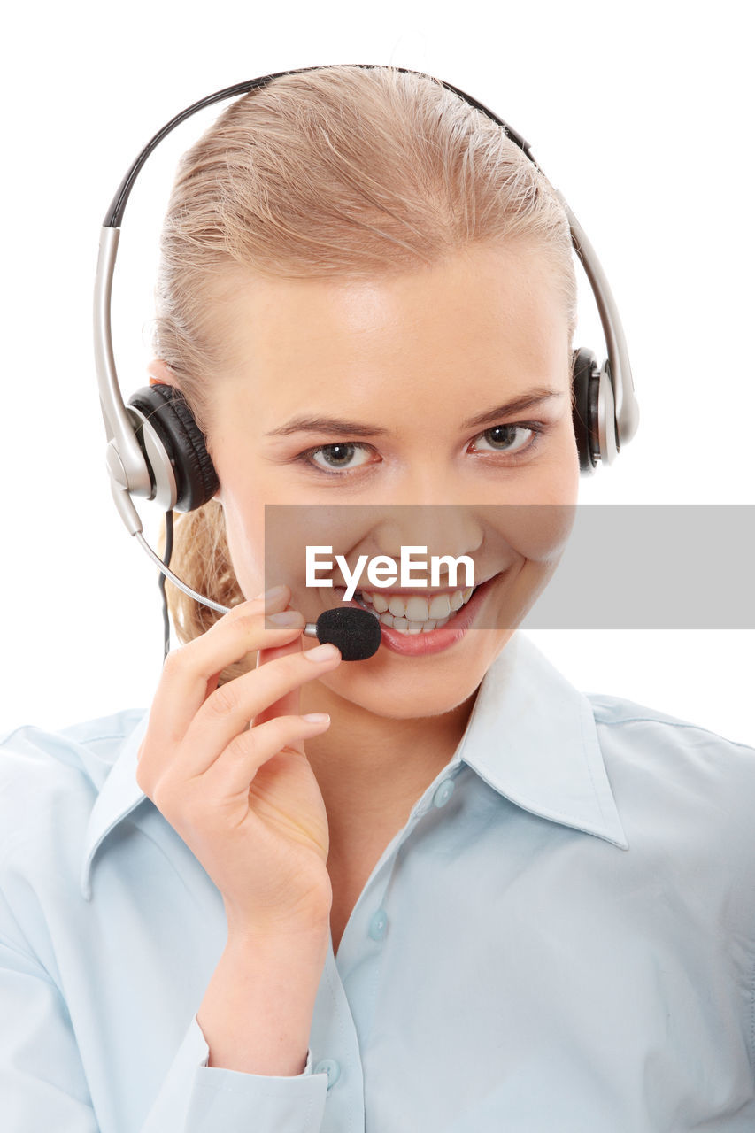 Portrait of customer service representative with headset against white background