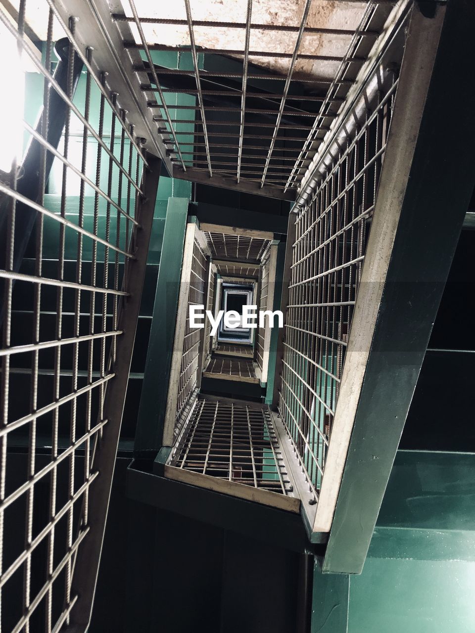 LOW ANGLE VIEW OF STAIRCASE AGAINST BUILDING