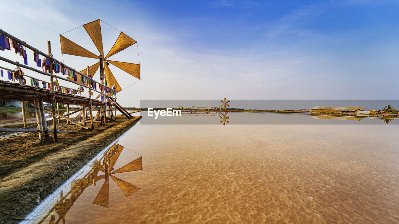 Tredition windmill on salt lake farm in thailand