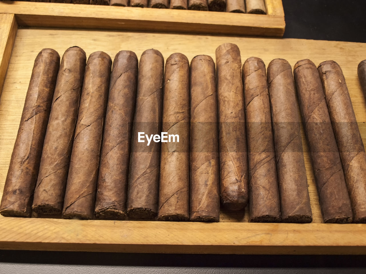 High angle view of cigars in tray