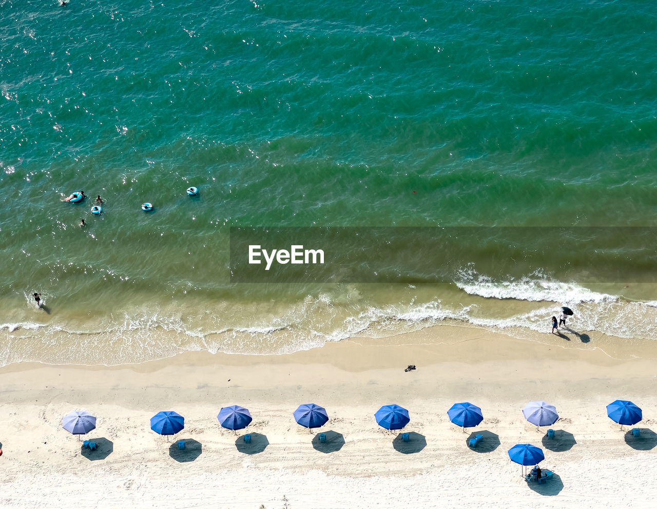 High angle view of people at beach, white beach
