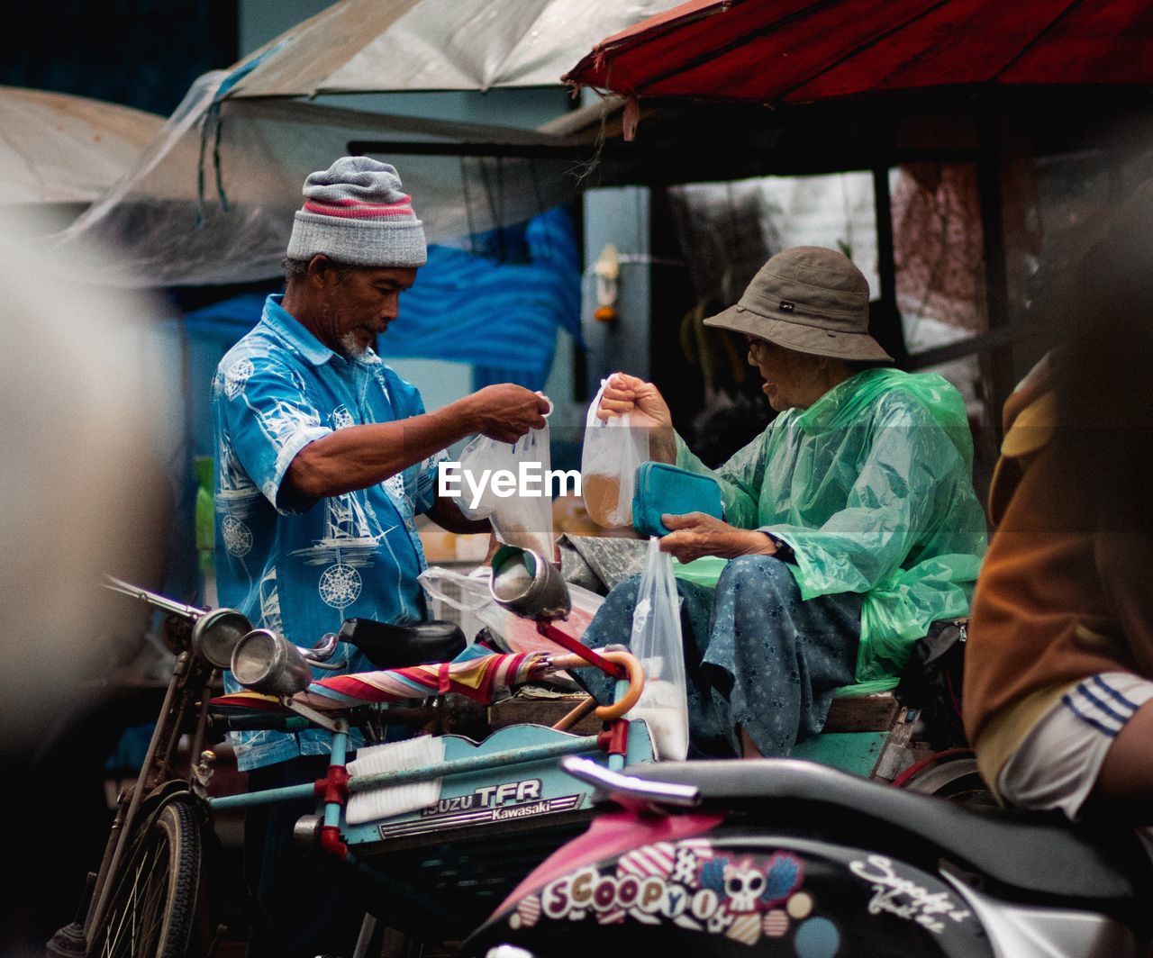 GROUP OF PEOPLE AT MARKET