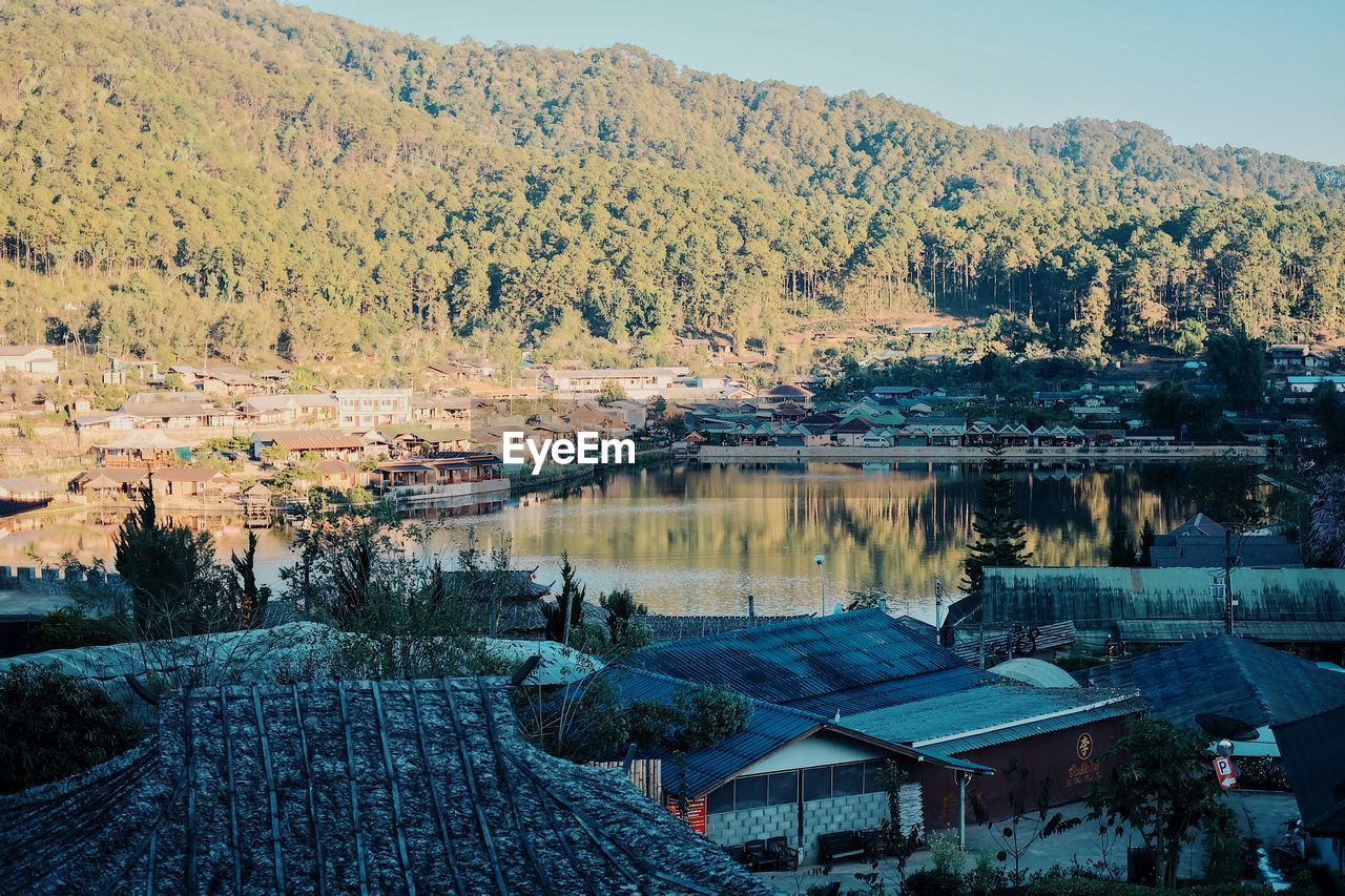 High angle view of townscape by lake