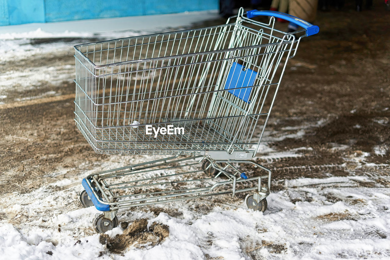 ABANDONED SHOPPING CART IN SNOW