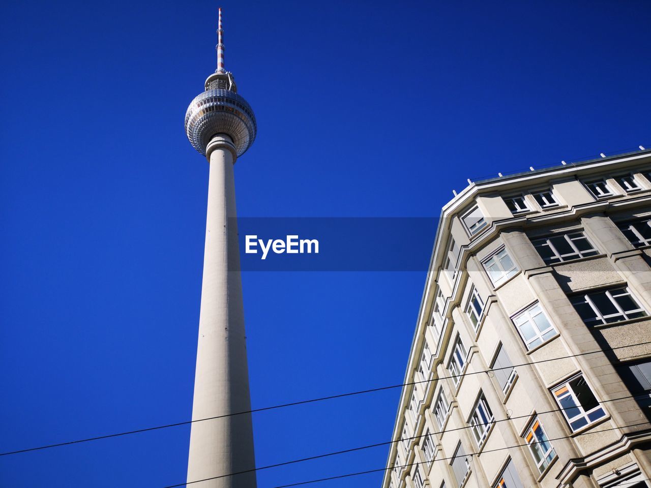 Low angle view of tower against blue sky