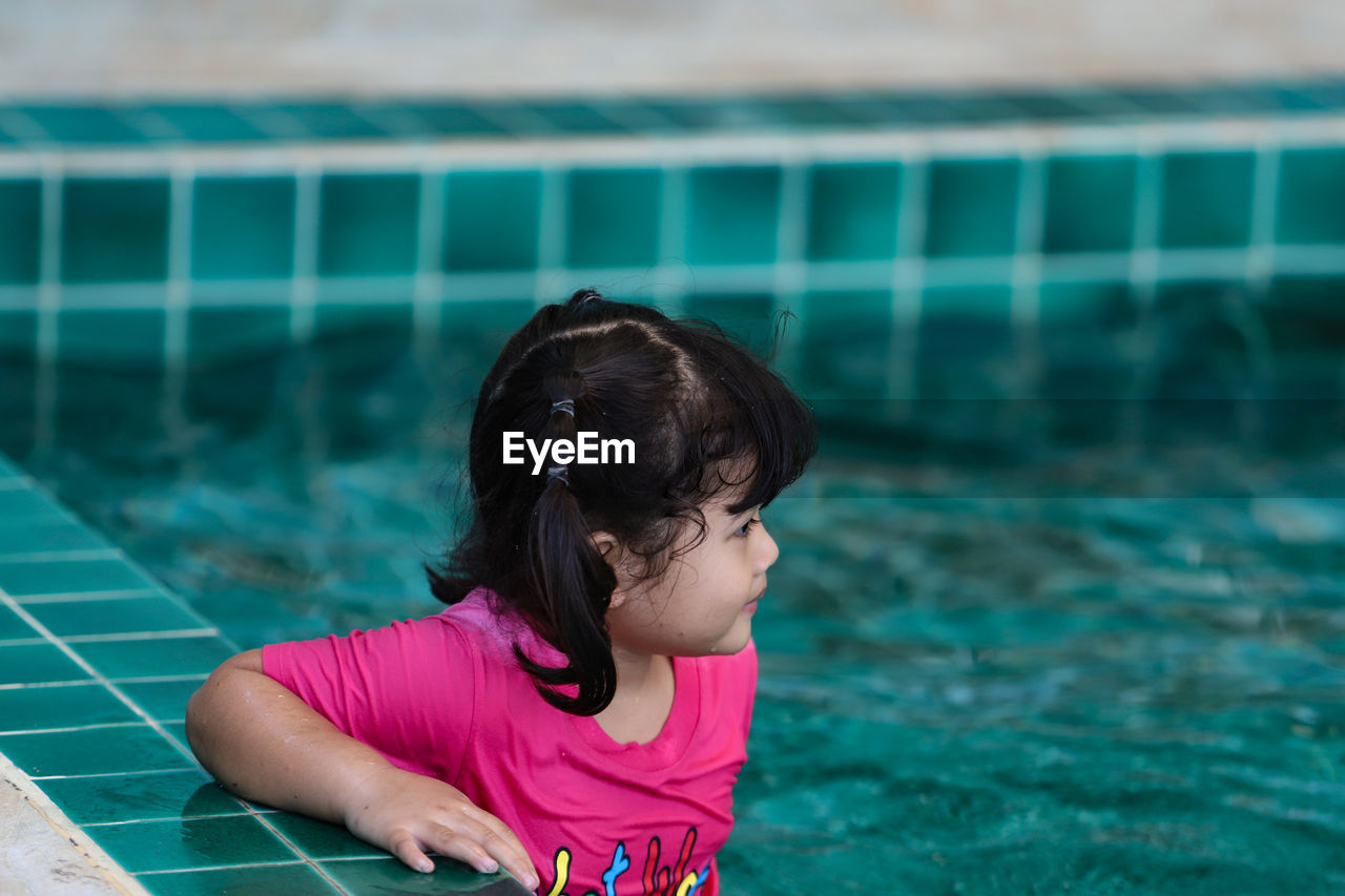 Portrait of girl in swimming pool