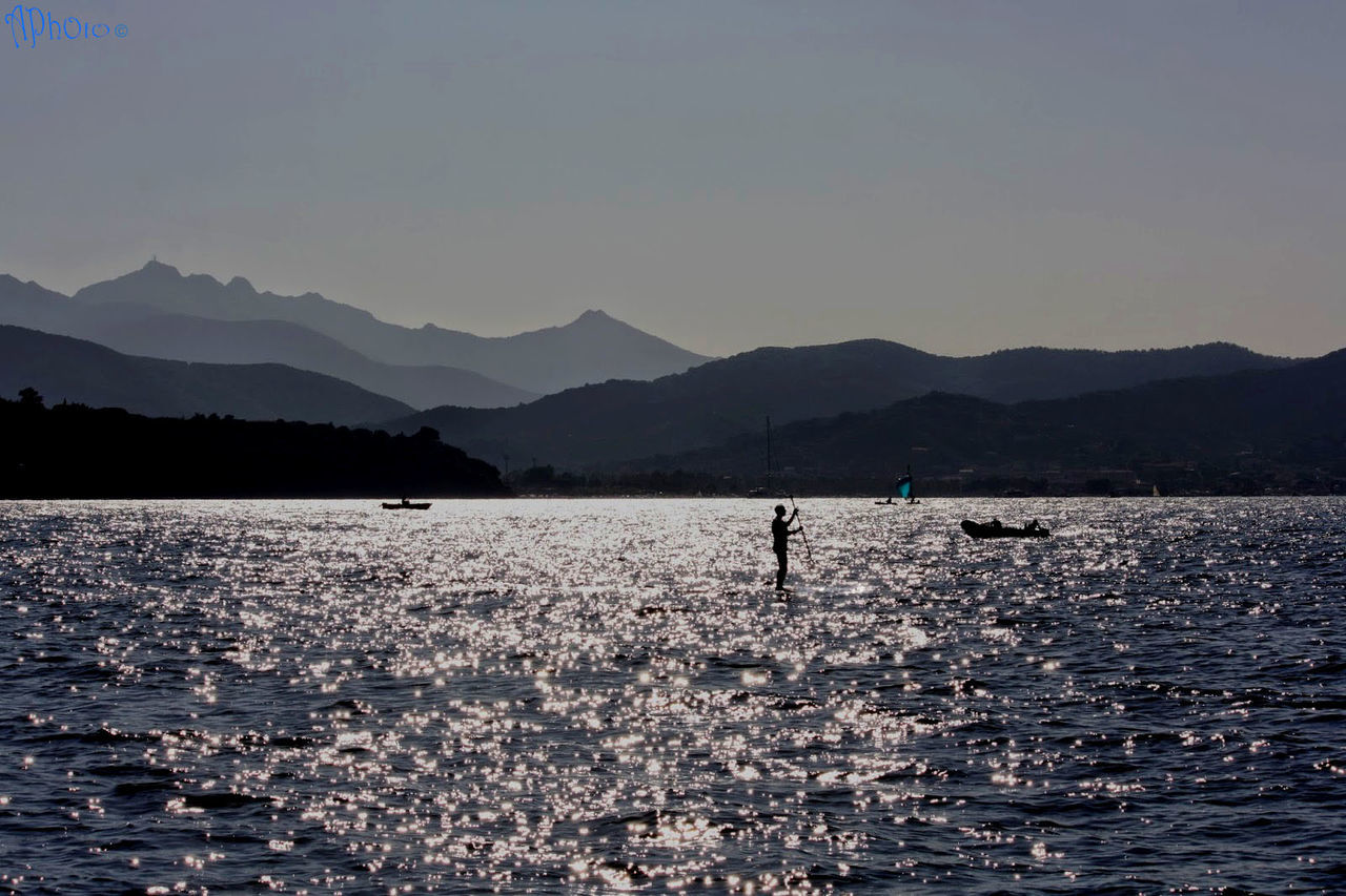 Scenic view of lake by mountains