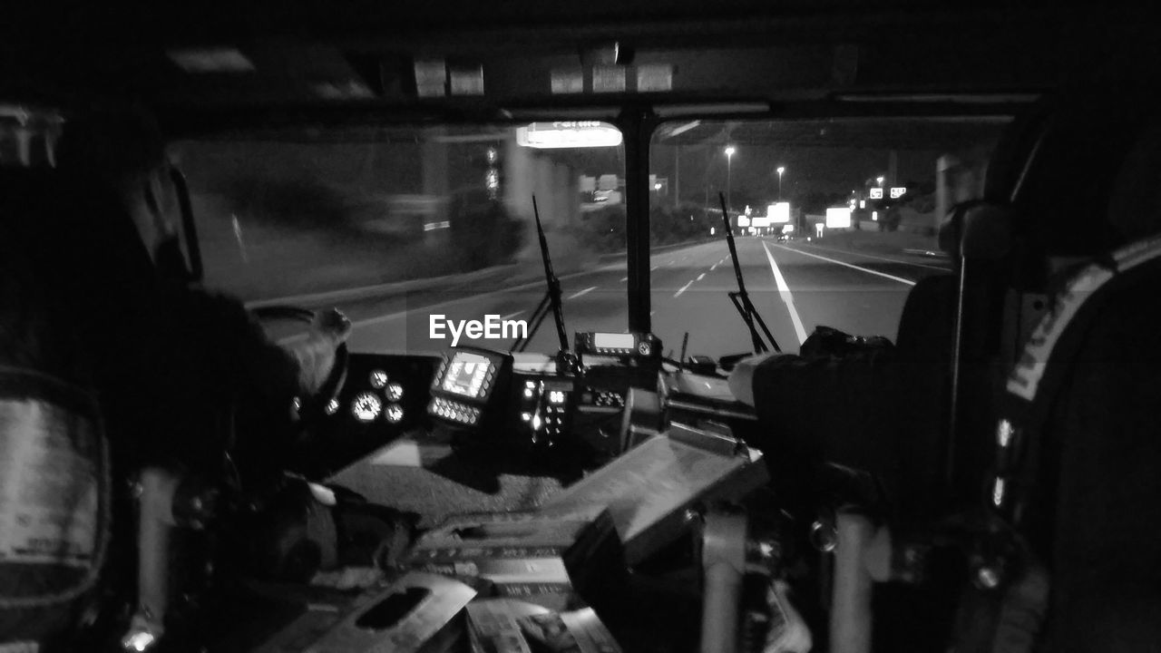 TRAIN SEEN THROUGH WINDSHIELD