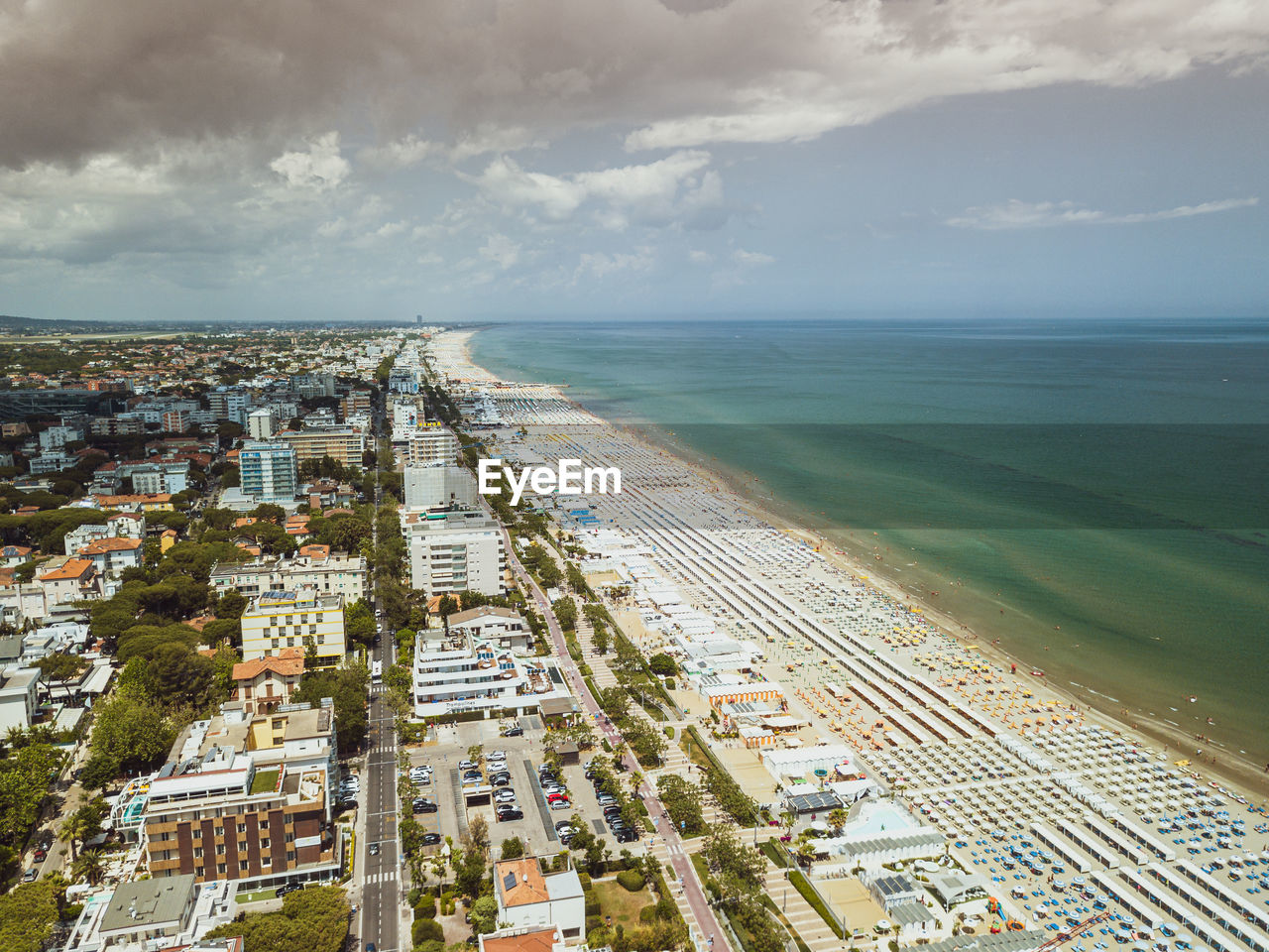 High angle view of sea and buildings against sky