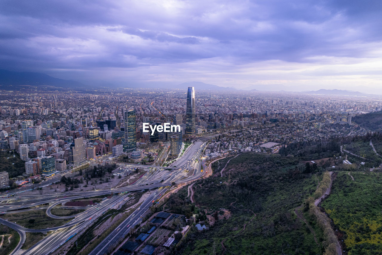 high angle view of cityscape against cloudy sky