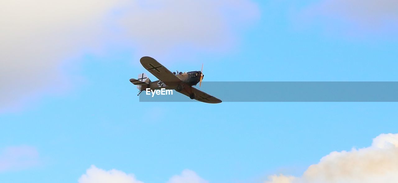 LOW ANGLE VIEW OF AIRPLANE AGAINST SKY