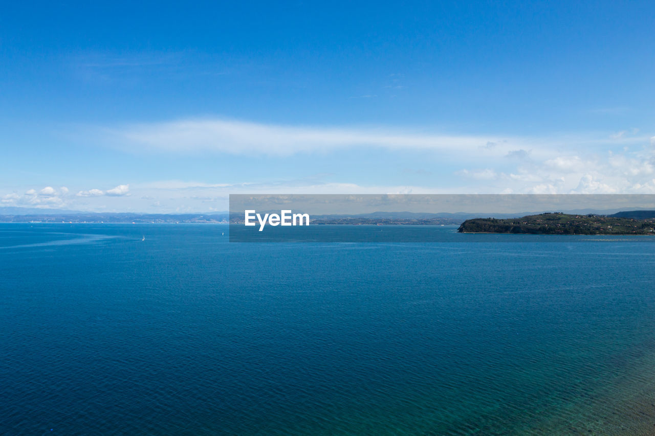 water, horizon, sea, scenics - nature, sky, beauty in nature, ocean, body of water, blue, land, tranquility, nature, coast, tranquil scene, cloud, beach, no people, environment, travel destinations, landscape, travel, bay, shore, island, day, outdoors, idyllic, coastline, seascape, dusk, tourism, holiday, trip, lagoon, vacation, non-urban scene, horizon over water, islet, reflection, mountain