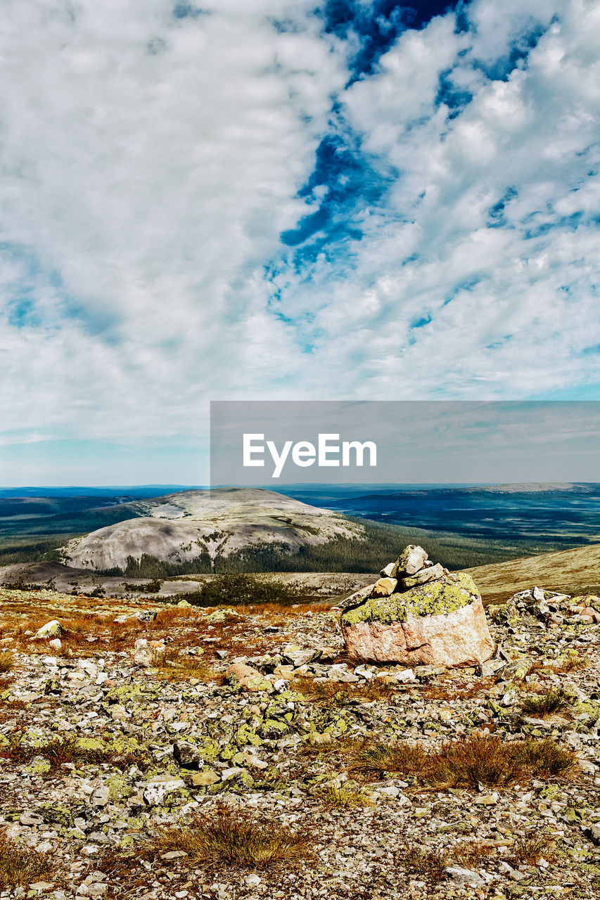 SCENIC VIEW OF ROCKS AGAINST SKY