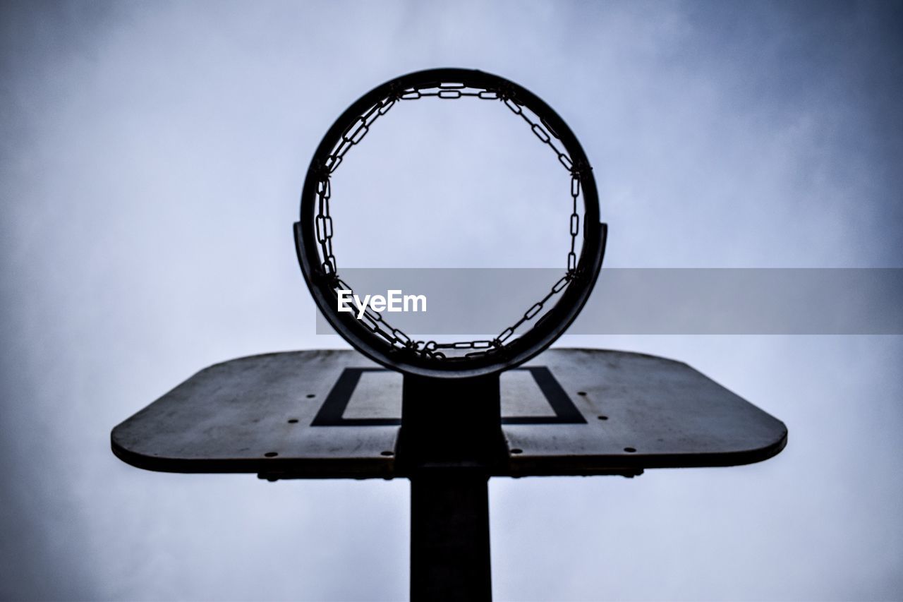 Low angle view of basketball hoop against sky