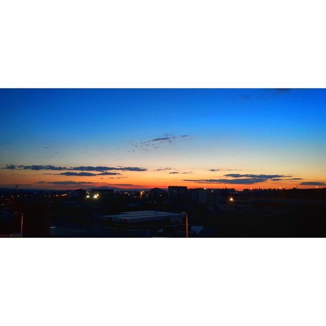 VIEW OF CITYSCAPE AT SUNSET