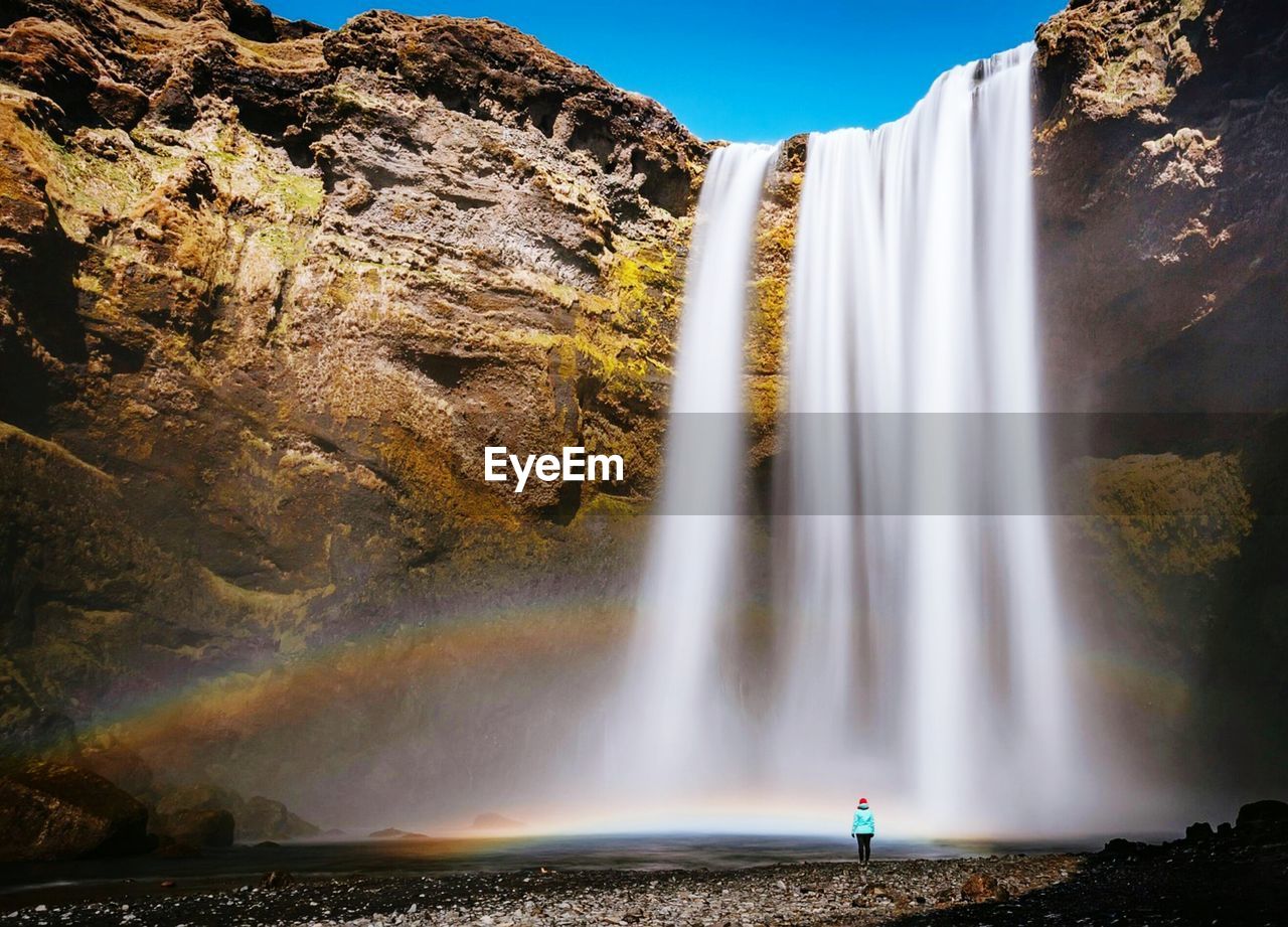 low angle view of waterfall against sky