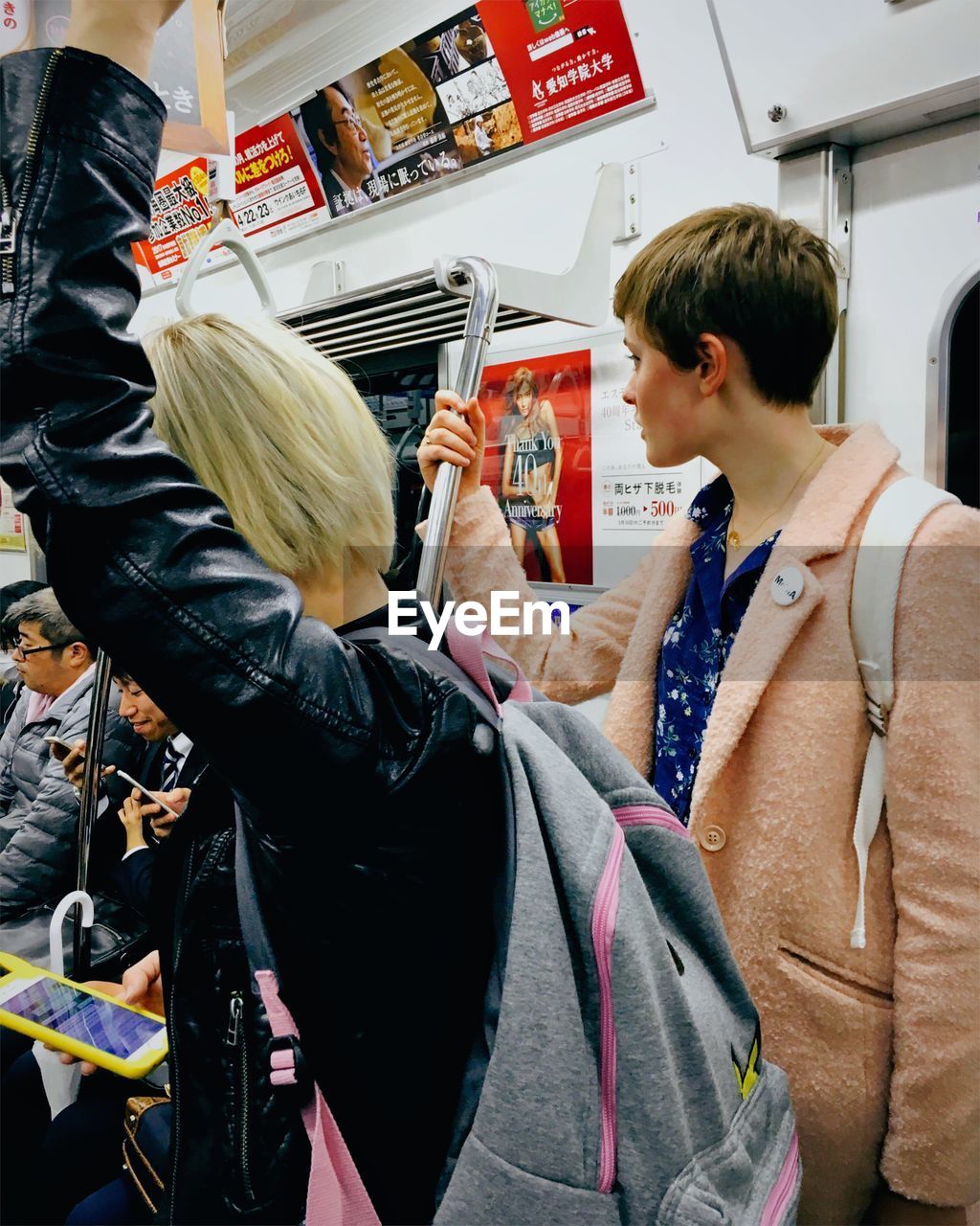 People traveling in subway train