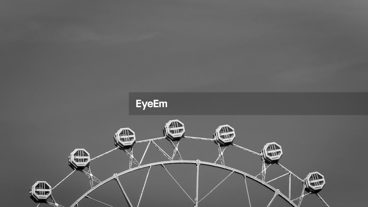 Low angle view of ferris wheel against sky