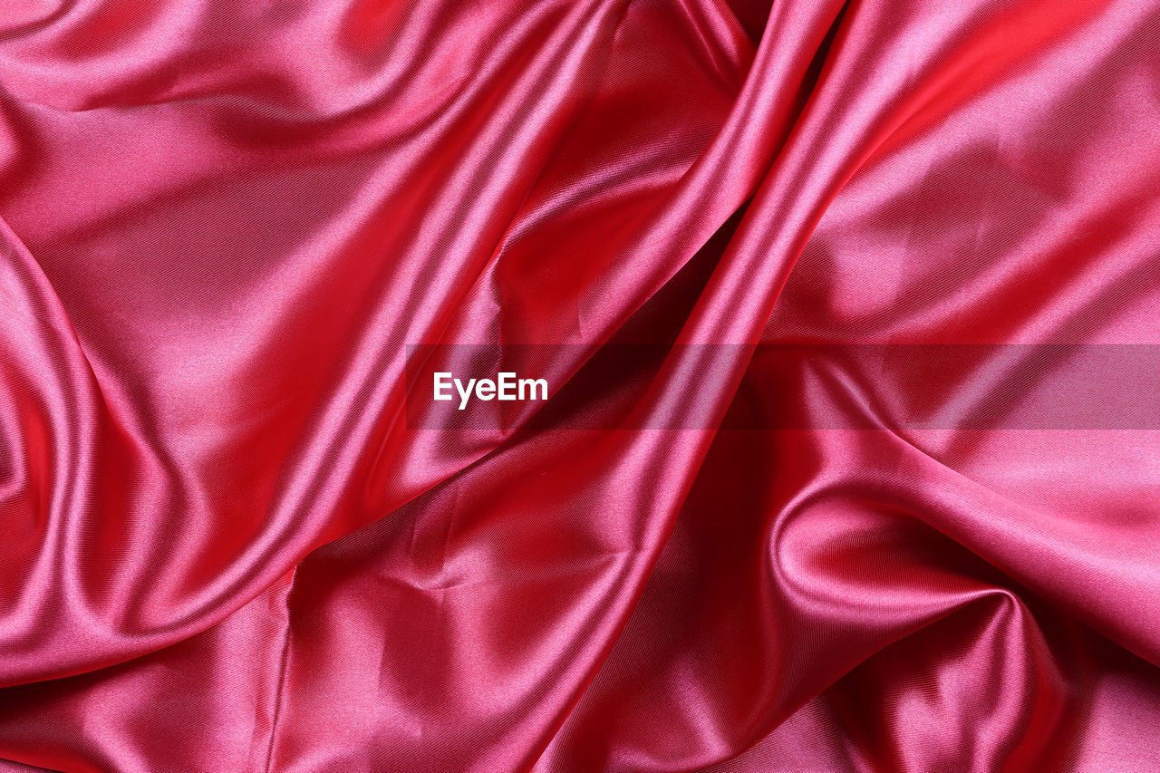 textile, pink, satin, rippled, backgrounds, silk, full frame, red, crumpled, wave pattern, pattern, wrinkled, petal, luxury, bed, smooth, folded, sheet, textured, no people, linen, wealth, curve, shiny, softness, abstract, velvet, elegance, directly above, material, magenta, indoors, high angle view, copy space, studio shot, clothing
