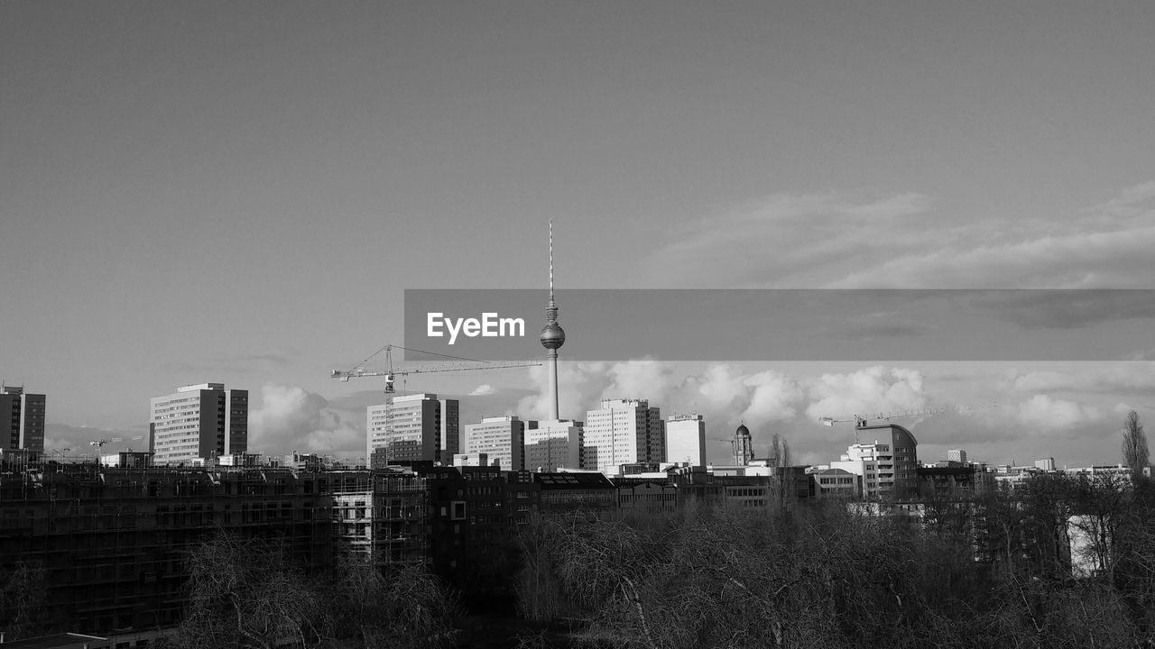 Fernsehturm tower with cityscape against sky