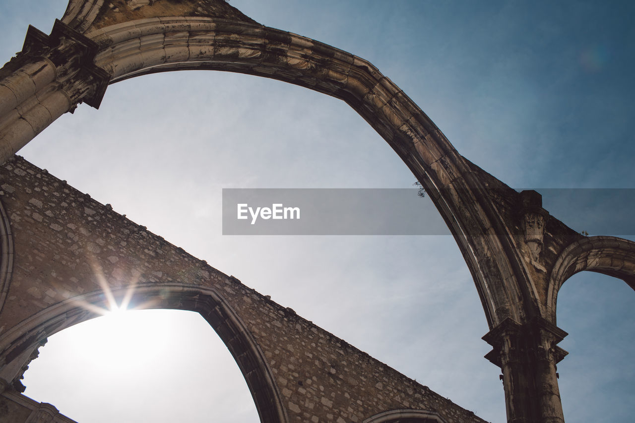 Low angle view of arch bridge against sky