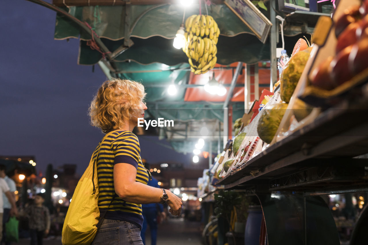 Morocco, woman at a market stall