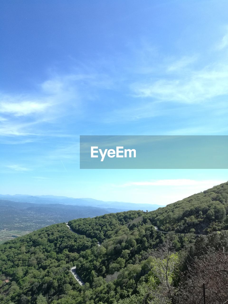 SCENIC VIEW OF GREEN LANDSCAPE AGAINST BLUE SKY