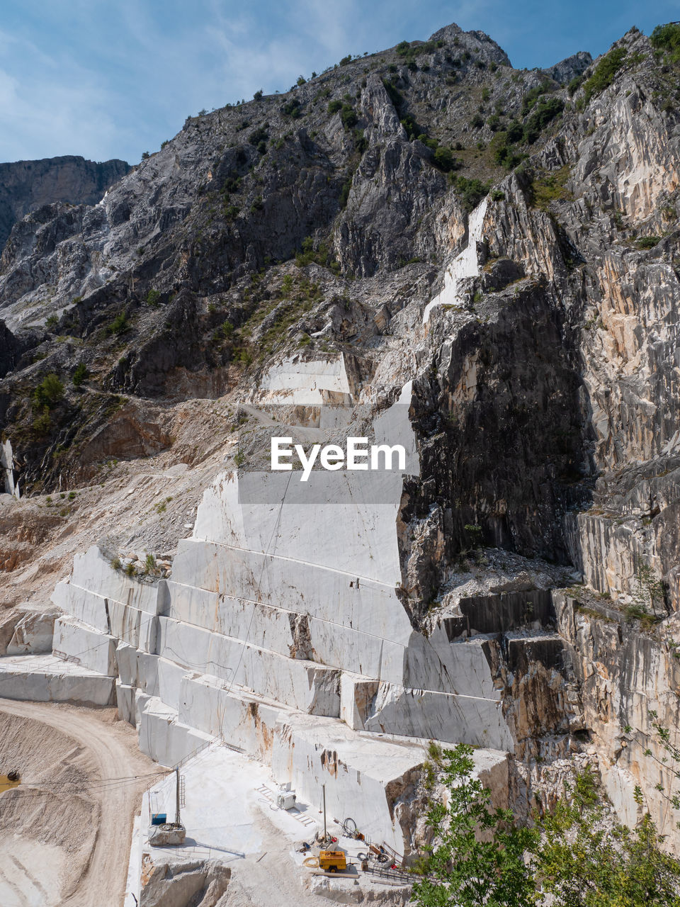 View of the carrara marble quarries with excavation vehicles ready for work.