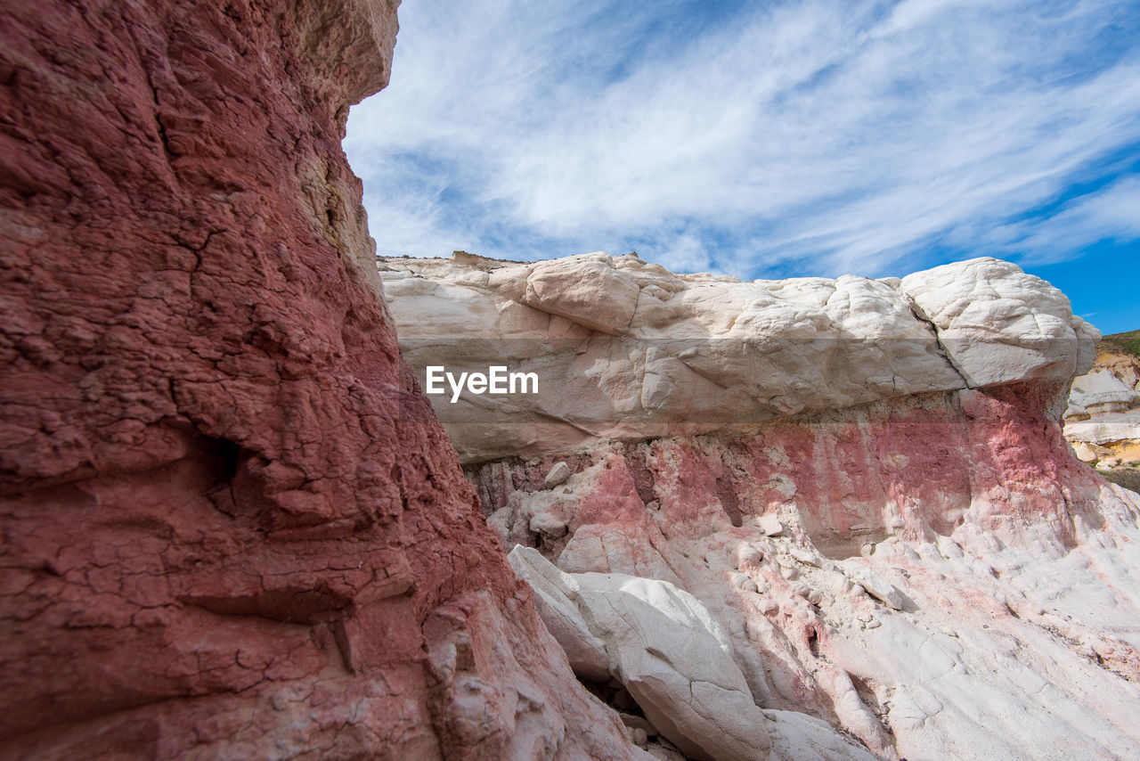 Landscape of pink, orange and white rock formations at interpretive paint mines in colorado