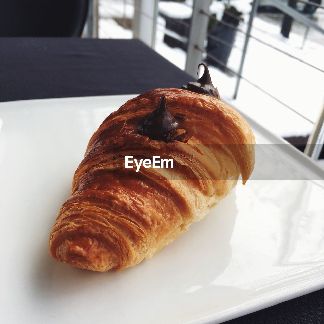 Close-up of croissant in plate