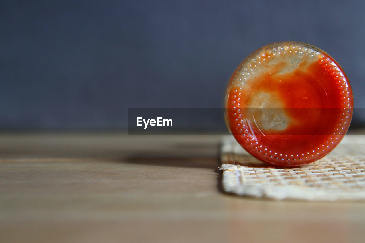 Close-up of ketchup bottle on table