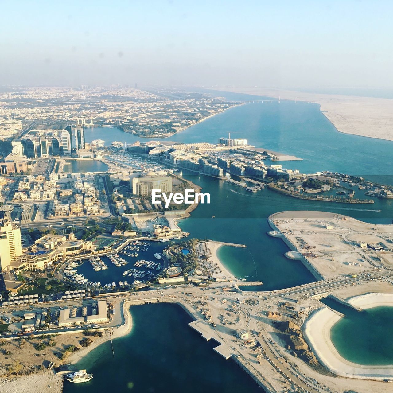 High angle view of sea and buildings in city