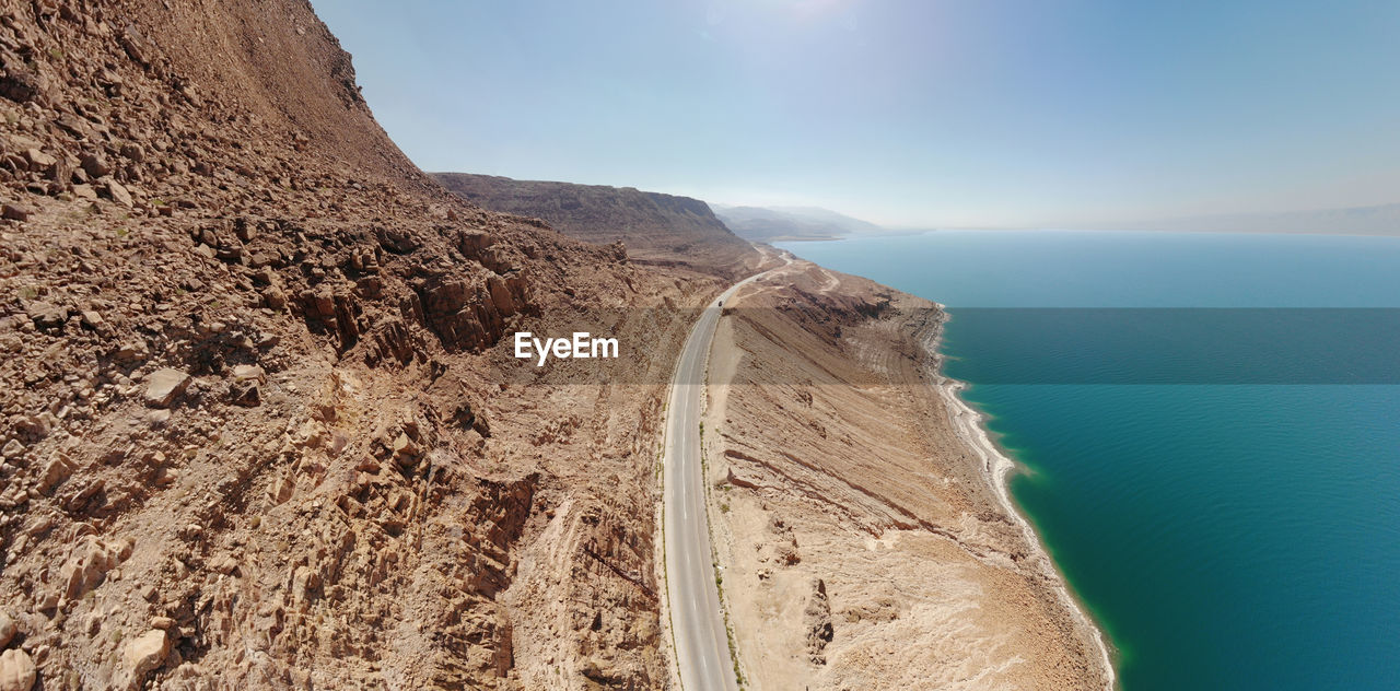 Aerial view from the main road along the dead sea, close to the rocks of the ascending mountains