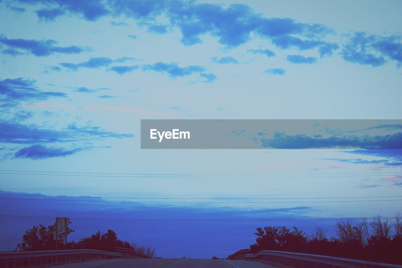 SCENIC VIEW OF BLUE SKY AND TREES AGAINST CLOUDY DAY