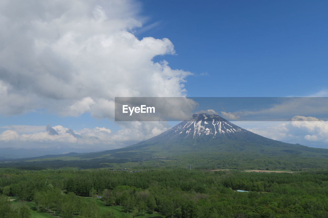 View of volcanic mountain against cloudy sky