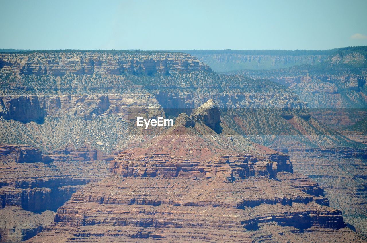 Scenic view of rocky mountains against clear sky at grand canyon national park