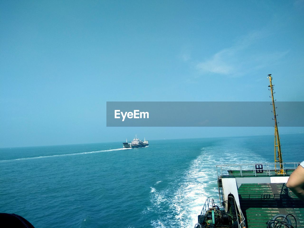 SHIP SAILING IN SEA AGAINST CLEAR SKY