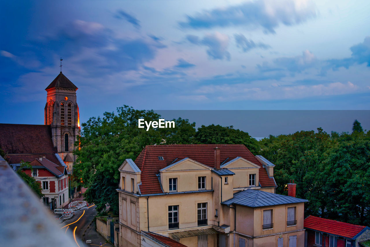 Houses and buildings against sky